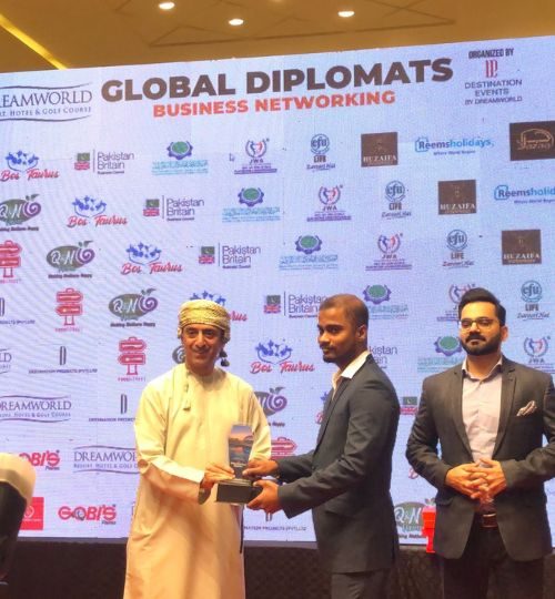 Receiving shield at Diplomats Networking 2023 from his legacy Sami A.Salim Consul General of Oman